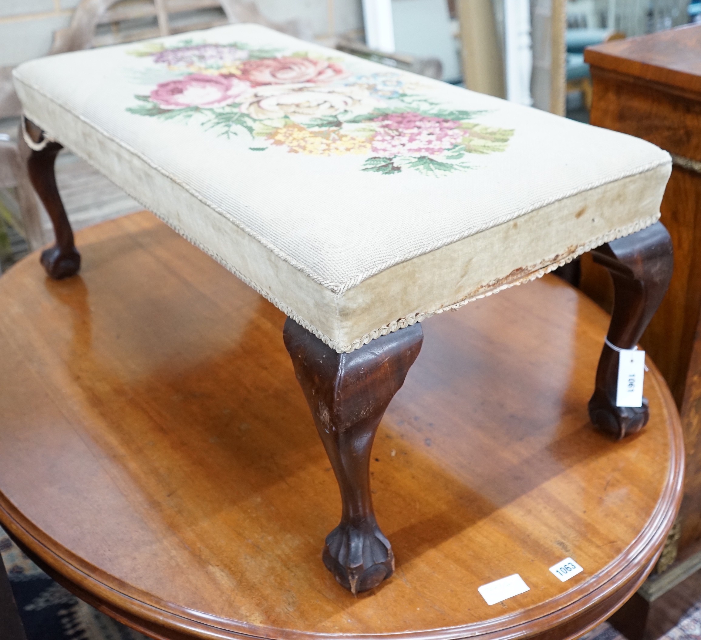A George II style mahogany dressing stool with tapestry seat width 100cms, depth 50cms, height 40cms.